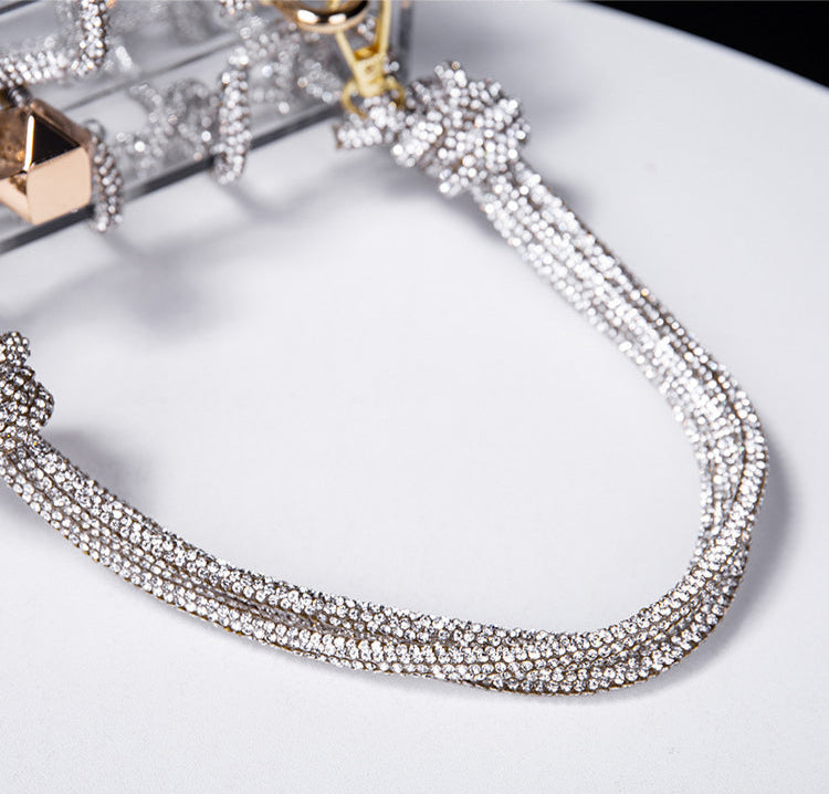 Pochette ceremonie mariage détail poignee cordelette strass 