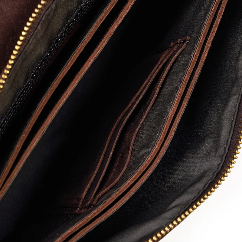 Pochette cuir veritable  dragonne compartiments interieurs