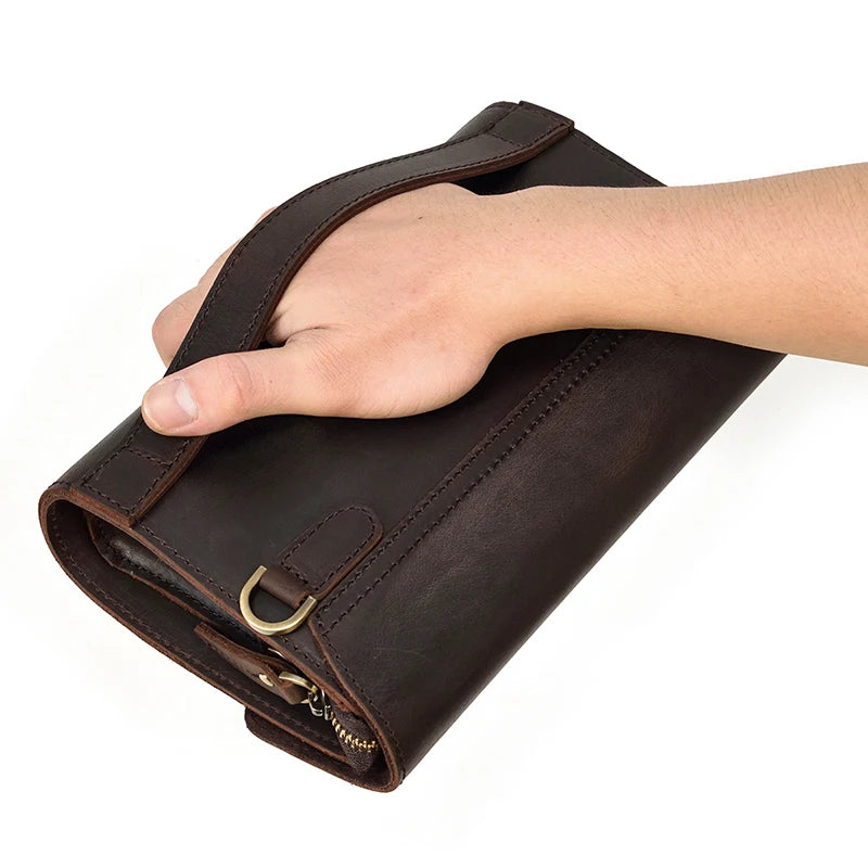 Pochette cuir veritable  dragonne poignee passante

