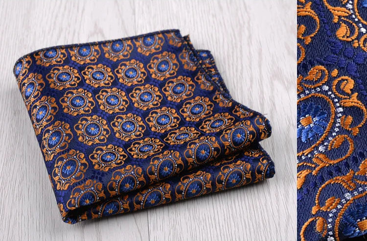 Pochette de costume  bleu nuit et arabesque oranges et blanches