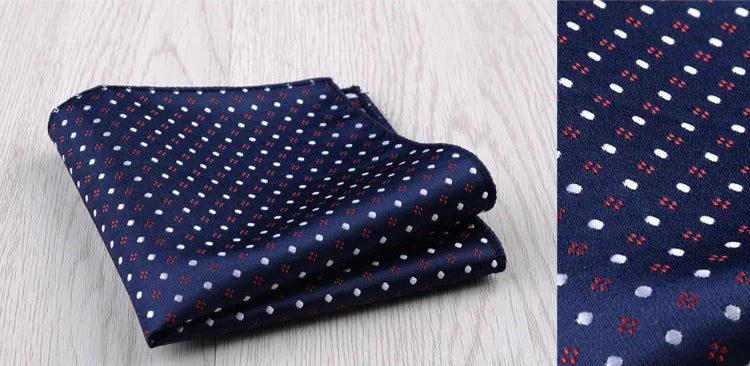Pochette de costume  bleu nuit et motifs blanc rouge