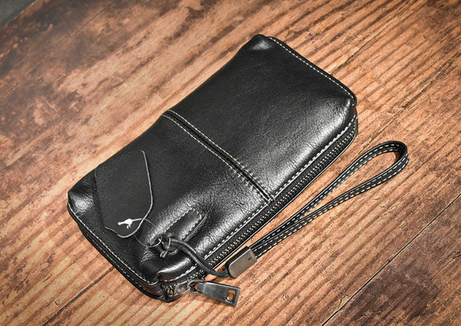 Pochette en cuir veritable dragonne  surpiqure