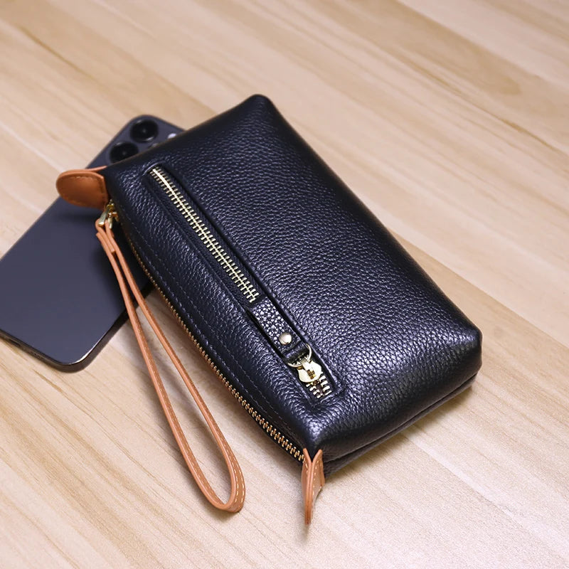 Pochette femme cuir noir zip dragonne poche exterieure bicolore 