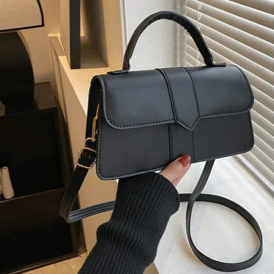 Sac main pochette noir
